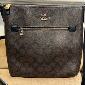 Coach Brown Crossbody with gold zipper closure